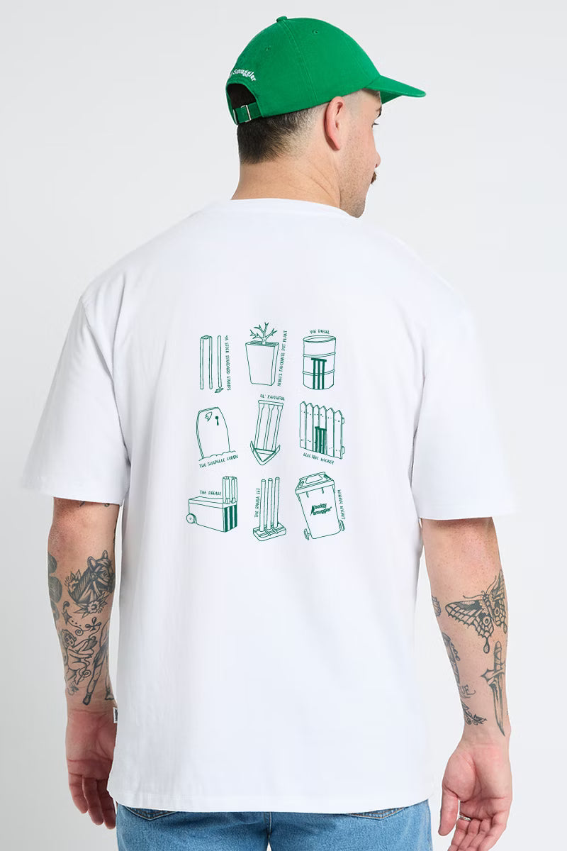 Back of the Lightweight White Tee in Cricket Wickets on a man in a green cap, large green print