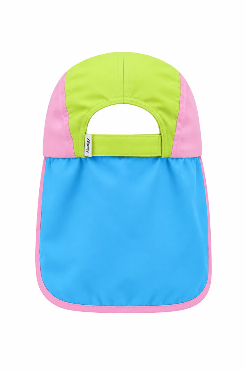 Pink green and blue hat with a neck flap on a white wall 