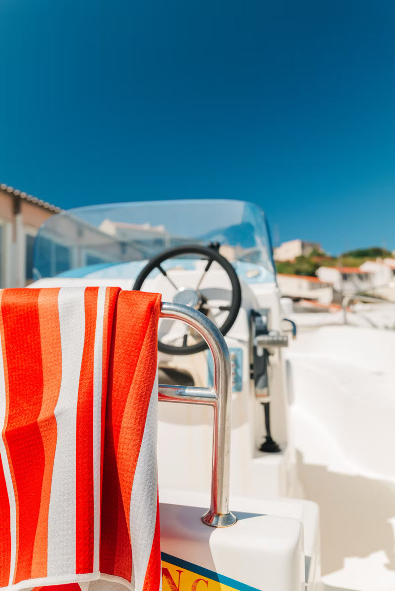 ORANGE AND WHITE STRIPE TOWEL ON BOAT 