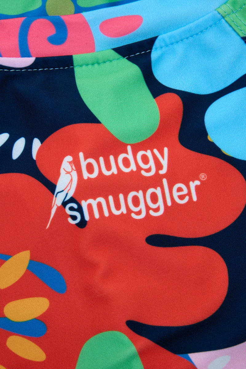 Close up of the Coastal Coral print and Budgy Smuggler logo