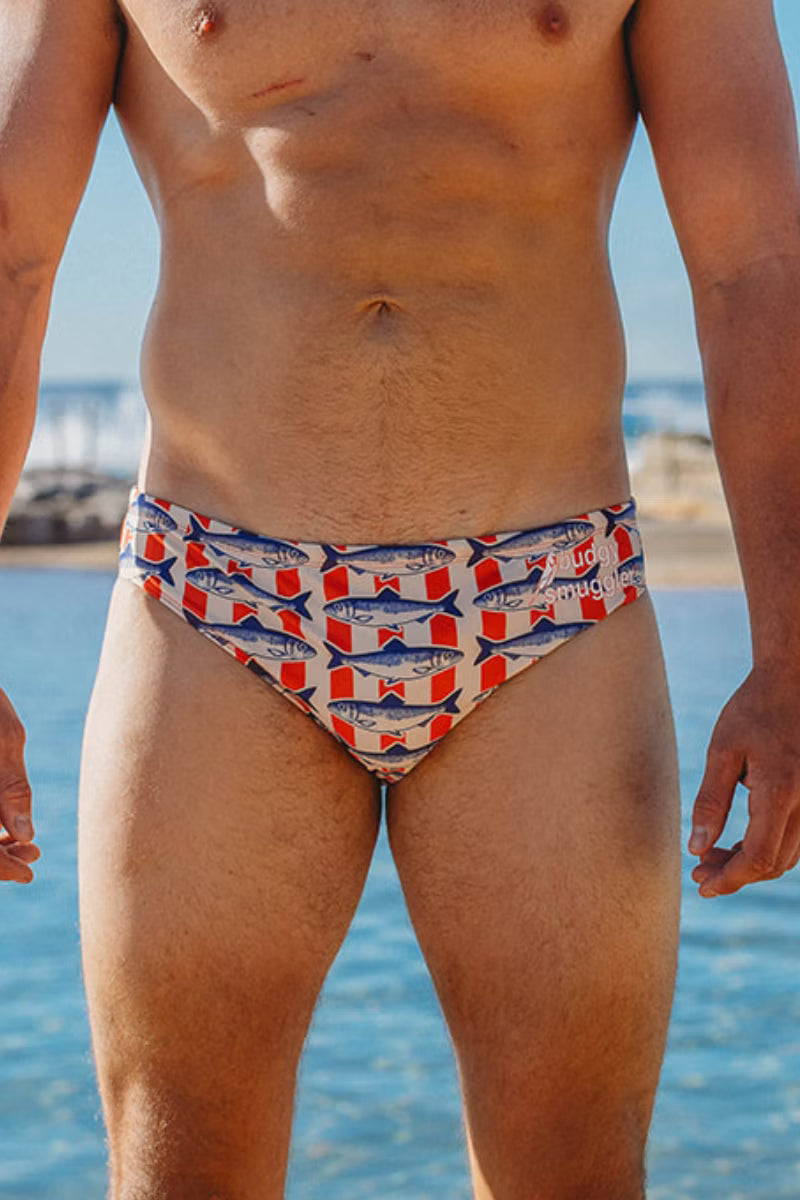 Front view of Packed In men's swimwear with navy sardine print