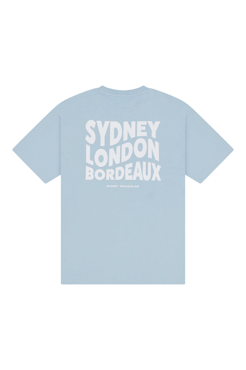 Light blue t-shirt with 'Sydney London Bordeaux' text on a white background