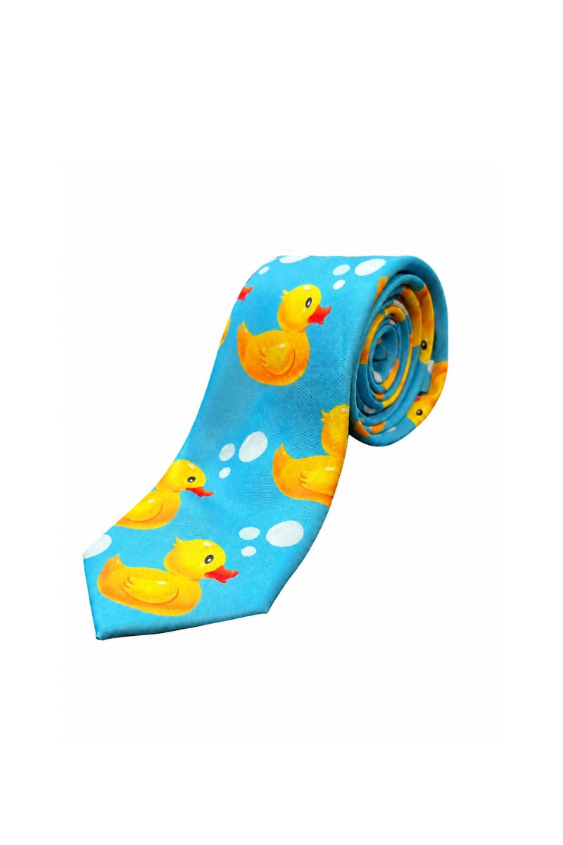 A rolled-up blue necktie featuring a playful pattern of yellow rubber ducks and white bubbles, set against a plain white background.