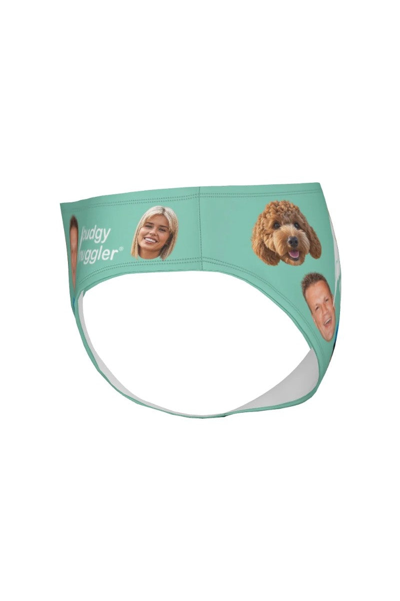 Angled view of custom family face print smugglers in mint green